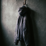 Heavyweight navy work hoodie on a steel hook